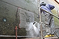 a ship�s hull is cleaned to the bare metal with 2500 bars working pressure